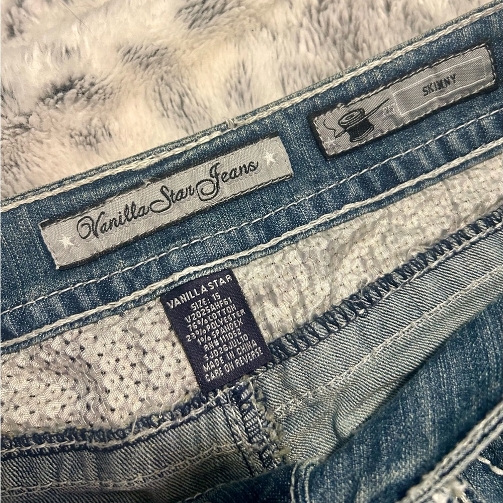 Distressed Vanilla Star Jeans with Fun Detailing
